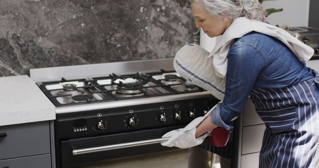 Senior Woman Baking in Modern Kitchen - Download Free Stock Images Pikwizard.com