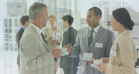 Business Professionals Networking Over Coffee in Modern Office