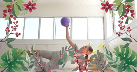 Woman practicing pilates with purple ball in bright studio surrounded by botanical overlays