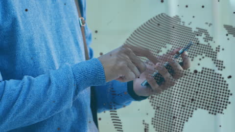 Businessman Using Smartphone Against Digital World Map Animation