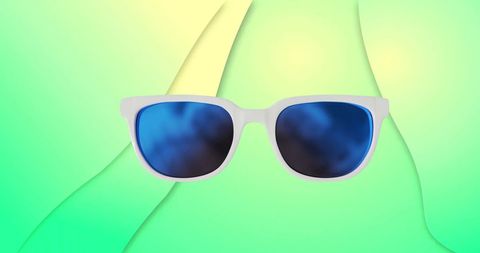 Stylish Blue Sunglasses on Abstract Green Background - Download Free Stock Images Pikwizard.com