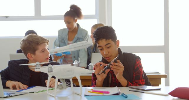 Diverse Students Collaborating on Drone Project in Classroom - Download Free Stock Images Pikwizard.com