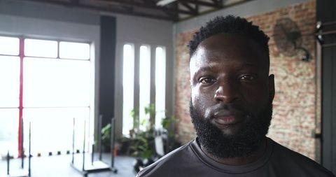 Confident African American Man in Gym Enduring Workout