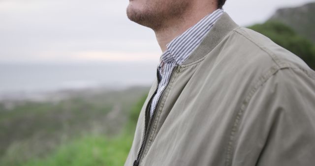 Close-up of man in casual jacket overlooking coastline - Download Free Stock Images Pikwizard.com