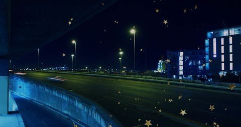Futuristic urban highway at night with golden star effects
