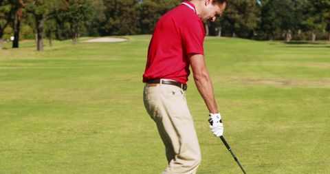 Golfer Teeing Off on Scenic Golf Course