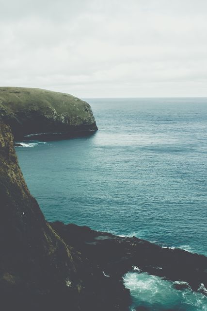Scenic Coastal Cliffs and Ocean on a Cloudy Day - Download Free Stock Photos Pikwizard.com