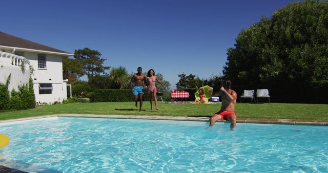 Diverse group of friends having jumping into a swimming pool - Download Free Stock Photos Pikwizard.com