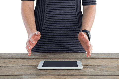 Transparent midsection person gestures above tablet on wooden table - Download Free Stock Videos Pikwizard.com