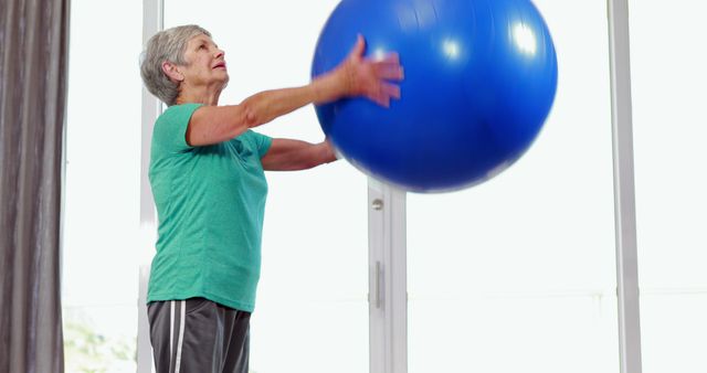 Senior Woman Exercising with Stability Ball at Home - Download Free Stock Images Pikwizard.com