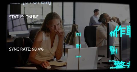 Focused businesswoman working on laptop in modern open office with digital status overlay