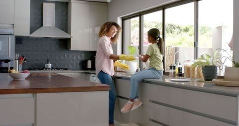 Happy Mother and Daughter Enjoying Time in Modern Kitchen - Download Free Stock Images Pikwizard.com