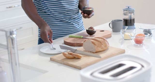 Person Preparing Healthy Breakfast with Avocado and Fresh Bread in Modern Kitchen - Download Free Stock Images Pikwizard.com