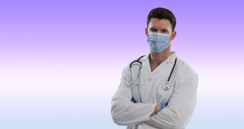 Confident Male Doctor Wearing Face Mask With Crossed Arms
