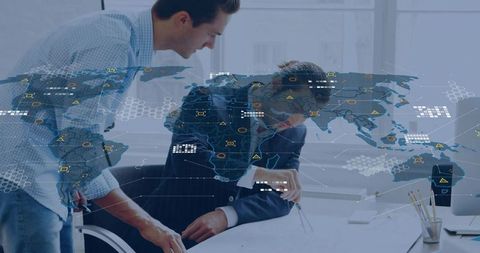 Business team collaborating over global data dashboard with geospatial analytics overlay
