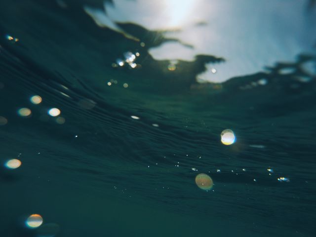 Underwater View of Sunlit Surface with Light Reflections - Download Free Stock Photos Pikwizard.com