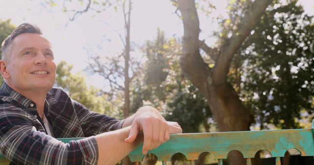 Man Relaxing on Bench in Sun-dappled Park - Download Free Stock Images Pikwizard.com