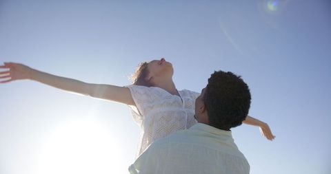 Happy Couple Embracing Sunlight with Open Arms - Download Free Stock Images Pikwizard.com