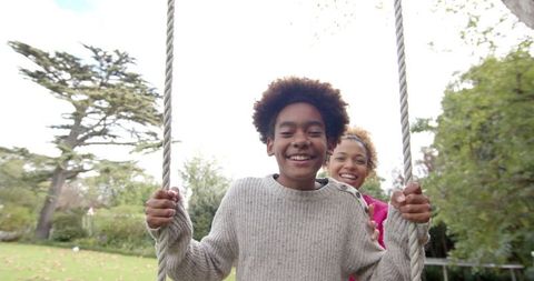 Mother and Son Enjoying Fun Outdoor Swing Experience - Download Free Stock Images Pikwizard.com