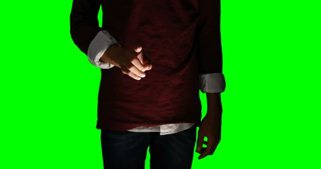 Person extending hand for a handshake on a green screen background. Useful for videos or materials needing a handshake action that can be placed in various settings via background replacement. Good for illustrating concepts of greeting, cooperation, partnership, or business interactions. Can be used in business presentations, marketing materials, or educational resources.