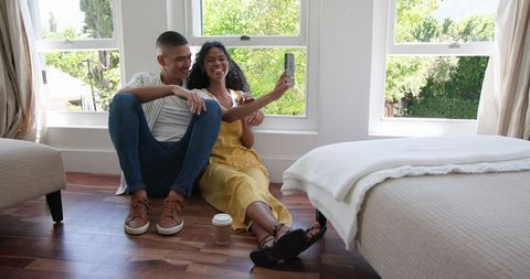 Happy Couple Taking Selfie at Home on Phone