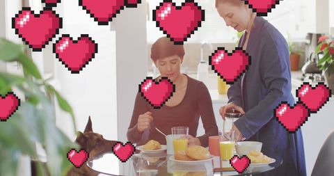 Happy Couple Enjoying Breakfast with Pixelated Hearts