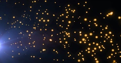 Golden bokeh particles drifting through dark void with blue lens flare and night glow