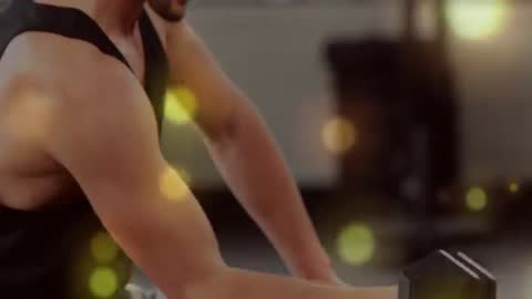 Muscular Man Performing Dumbbell Curls with Hex Dumbbell Closeup and Warm Bokeh Lighting