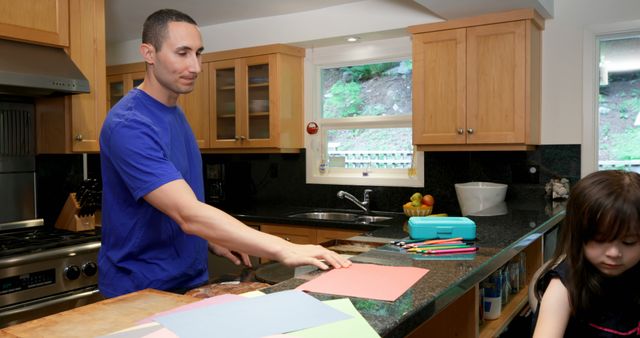 Father and Daughter Engaging in Creative Activities in Kitchen - Download Free Stock Images Pikwizard.com