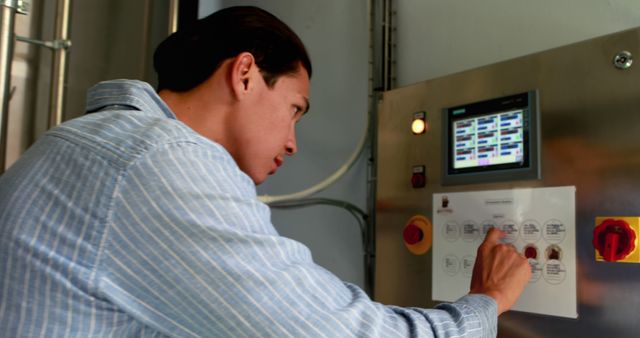 Engineer Operating Industrial Control Panel in Factory - Download Free Stock Images Pikwizard.com