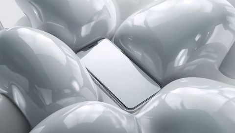 Smartphone amid glossy white organic forms