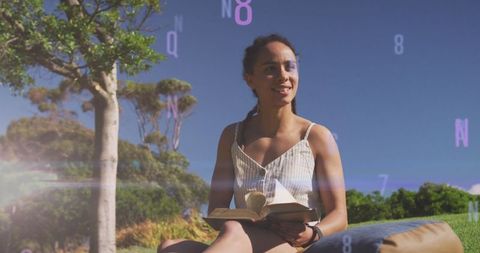 serene woman reading outdoors surrounded by numbers - Download Free Stock Images Pikwizard.com