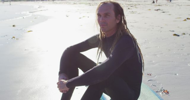 Surfer with Dreadlocks Sitting on Beach - Download Free Stock Images Pikwizard.com