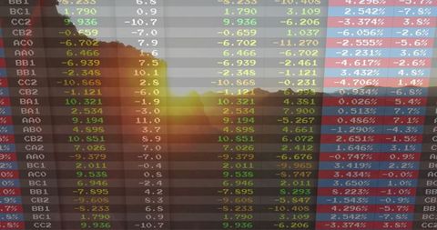 Digital Ticker Overlaid on Sunrise Through Forested Hillside