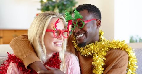 Festive couple celebrating christmas with joyful smiles