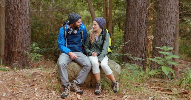 Couple Enjoying a Hiking Break in Forest - Download Free Stock Images Pikwizard.com