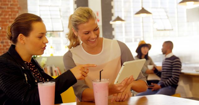 Women Discussing Work Over Smoothies in Modern Cafe - Download Free Stock Images Pikwizard.com