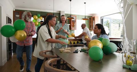 Senior Friends Decorating for a Joyful Celebration at Home