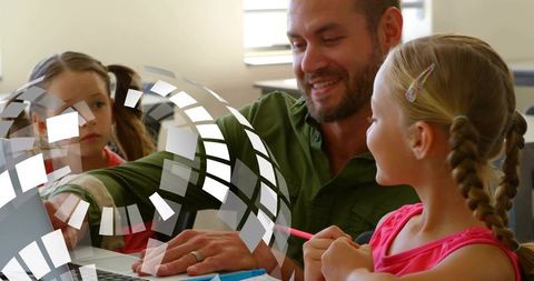 Man tutoring young girls on laptop with digital overlay showing interactive learning