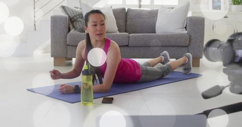 Instructor Leading Online Fitness Session from Home Living Room