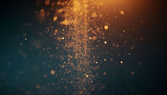 Ethereal golden particles cascading against dark background
