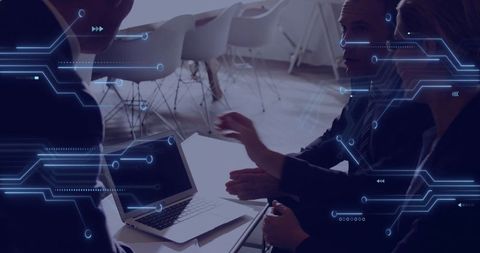 Business Team Collaborating in Tech-Enhanced Conference Meeting