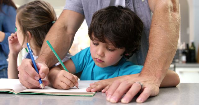 Parent Guiding Child with Homework in Kitchen - Download Free Stock Images Pikwizard.com