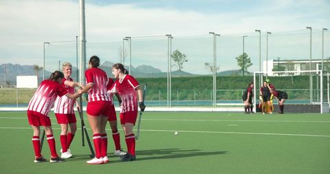 Female Field Hockey Team Inspiring Unity and Team Spirit Outdoor