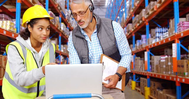 Warehouse Workers Communicating with Headset and Laptop in Distribution Center - Download Free Stock Images Pikwizard.com