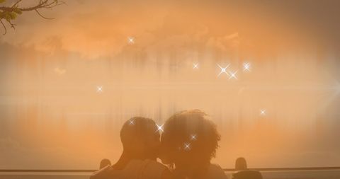 Romantic afro-american couple kissing at sunset beach with starry glow