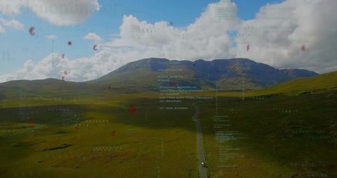 Augmented reality overlays guiding car along winding road through mountain valley