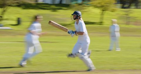 Female Cricketer Sprinting Between Wickets Capturing Action and Determination