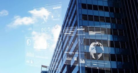 Futuristic glass skyscraper reflecting sky with digital data overlays and global analytics HUD