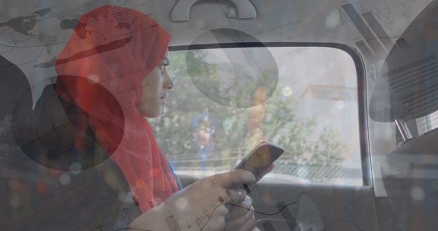 Muslim Businesswoman Working on Mobile Device During Commute - Download Free Stock Images Pikwizard.com